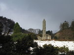 SX02586 Round Tower Glendalough in snow.jpg